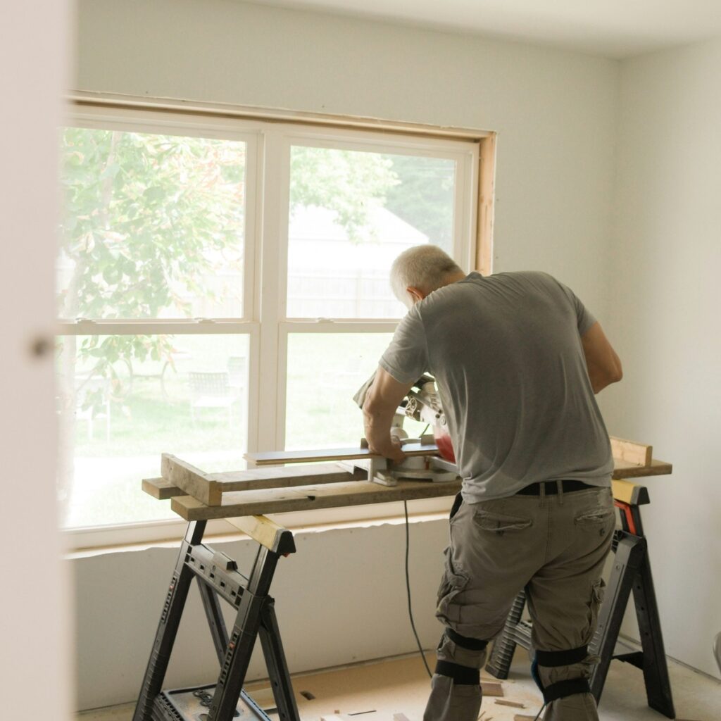 Professional window replacement in Mount Pleasant, SC with a technician installing a new residential window