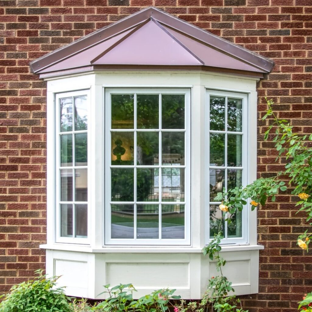 Trusted window replacement in James Island, SC featuring a white bay window installed by Charleston Roofs + Windows